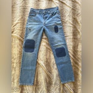 Classic broken in women’s Levi’s 501s, distressed/patched by hand, vintage 28/30